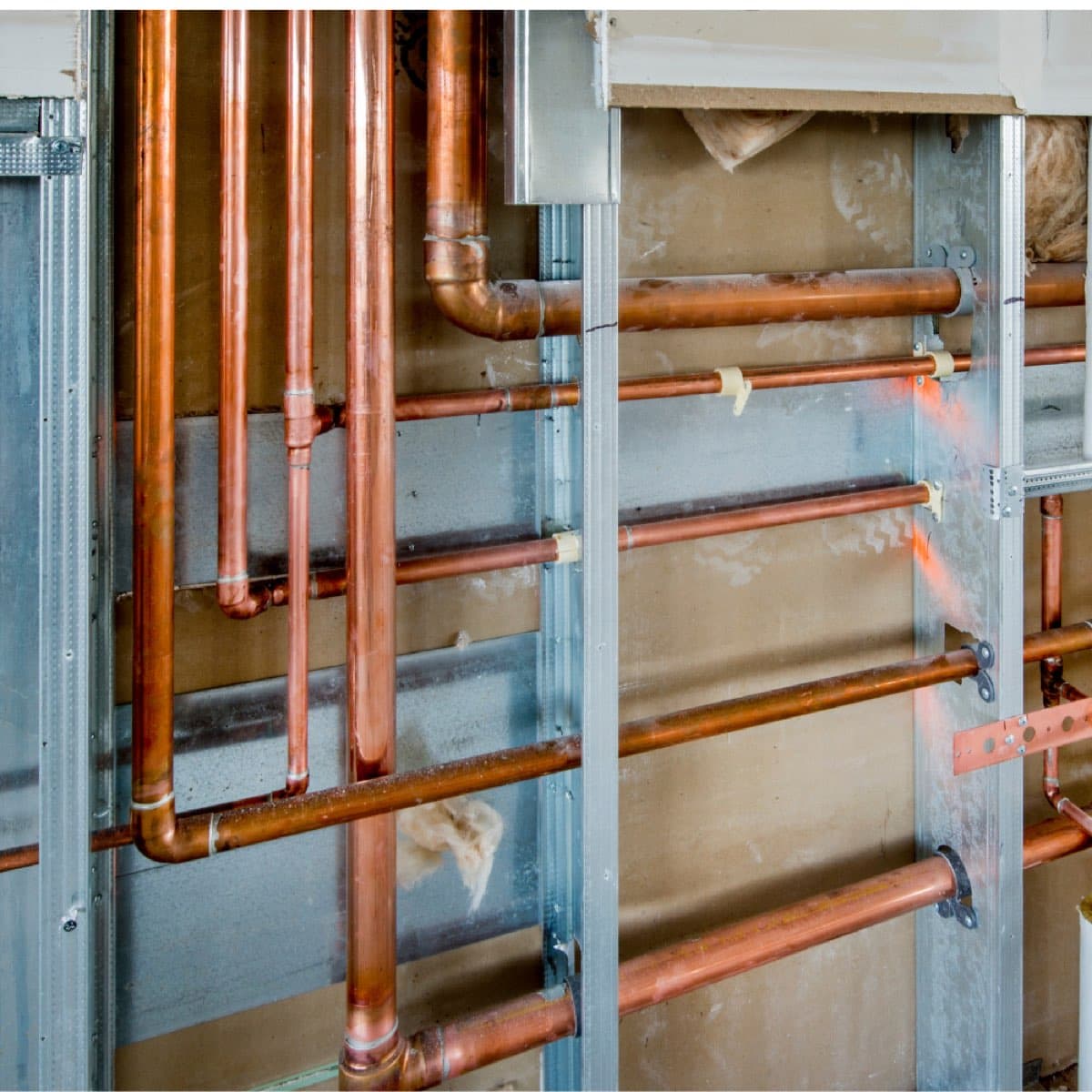 Freshly installed copper plumbing pipes in a stud wall rough-in, Pipe & Plumber
