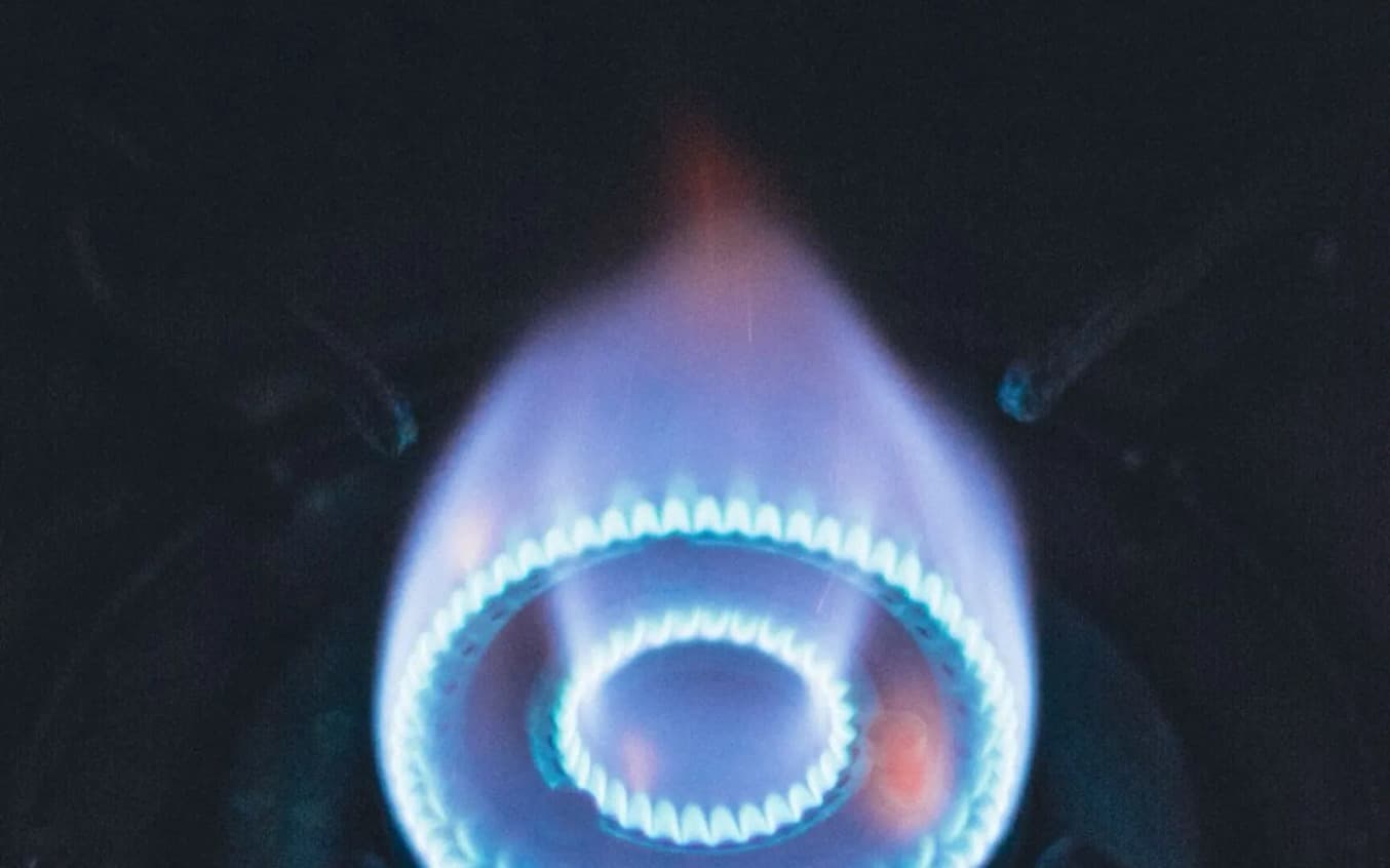 Blue gas burner flame inside a furnace