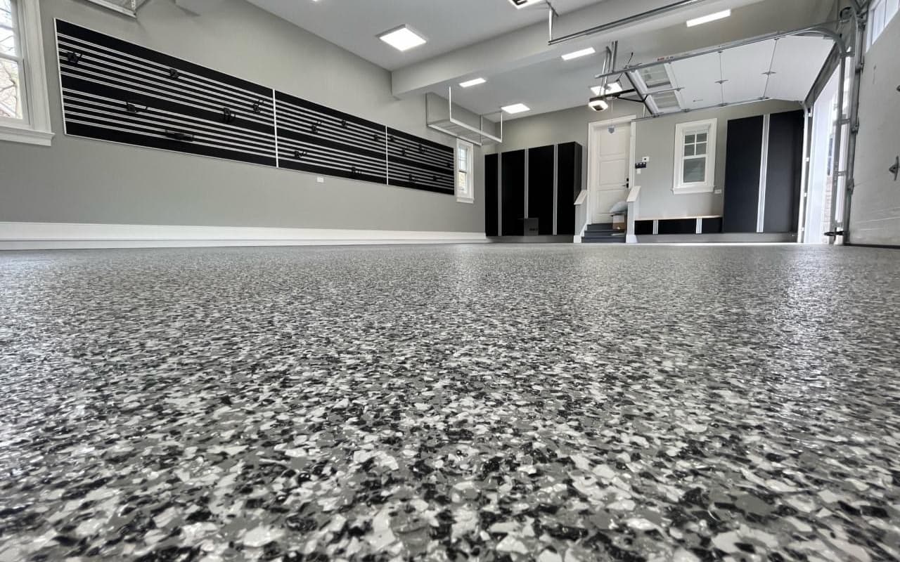 Finished gray flake epoxy garage floor coating installed by New England Epoxy