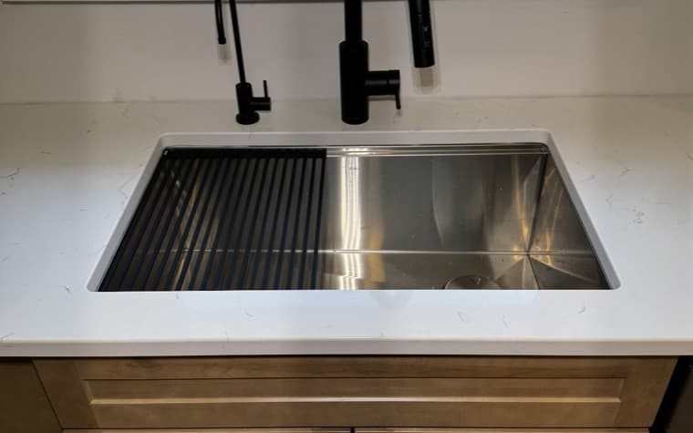 Modern kitchen sink and black faucet installation by RJC Plumbing in Augusta, Maine